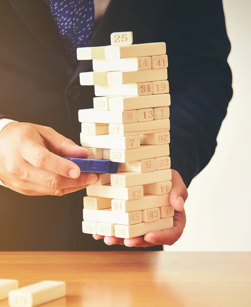 Strategic Thinking Businessman Plays Wooden Blocks 2 Strategic Thinking Businessman Plays Wooden Blocks 2